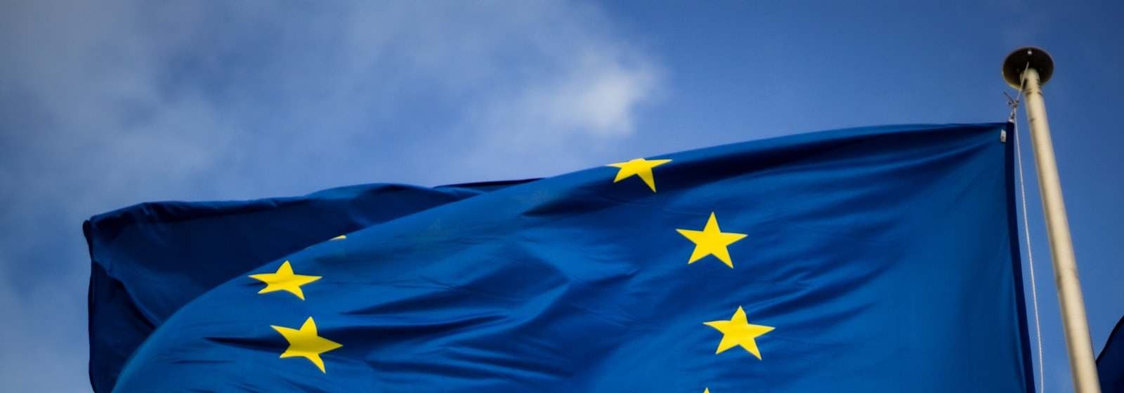 The flag of the European Union against a blue sky