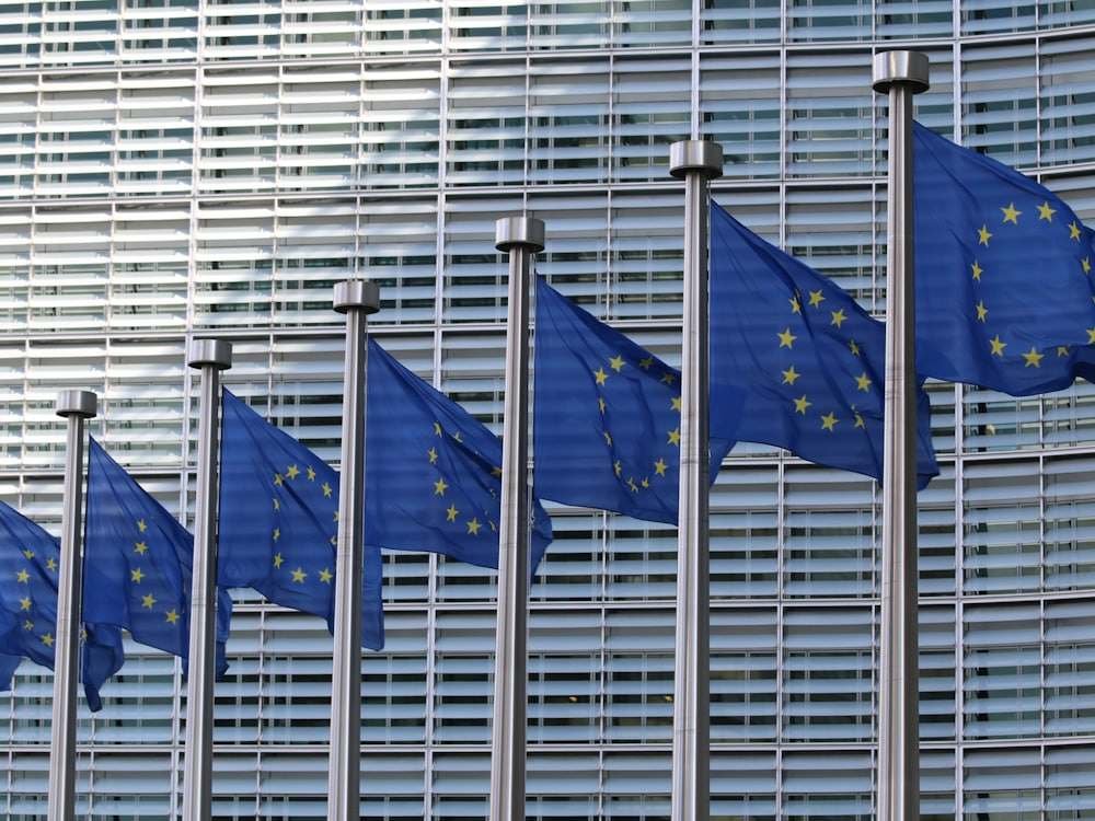 European Union flags in front of the Berlaymont building in Brussels