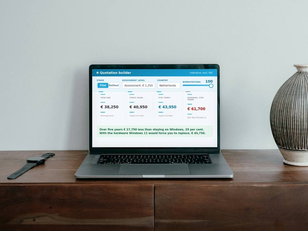A laptop on a desk showing the NEXZOS quotation builder