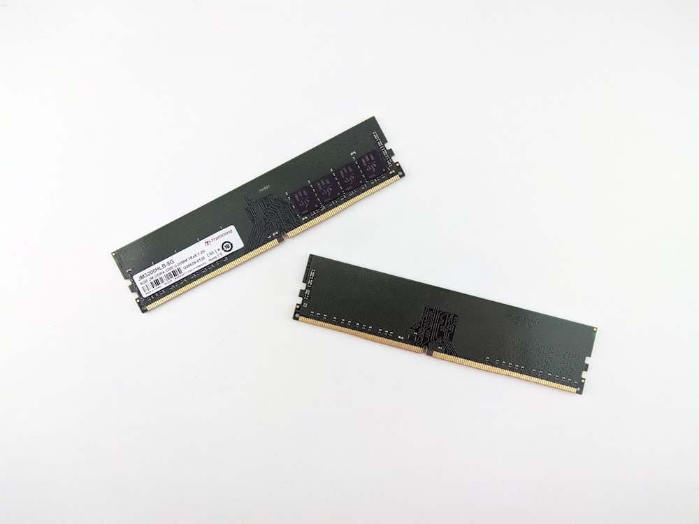 Two memory modules on a white surface